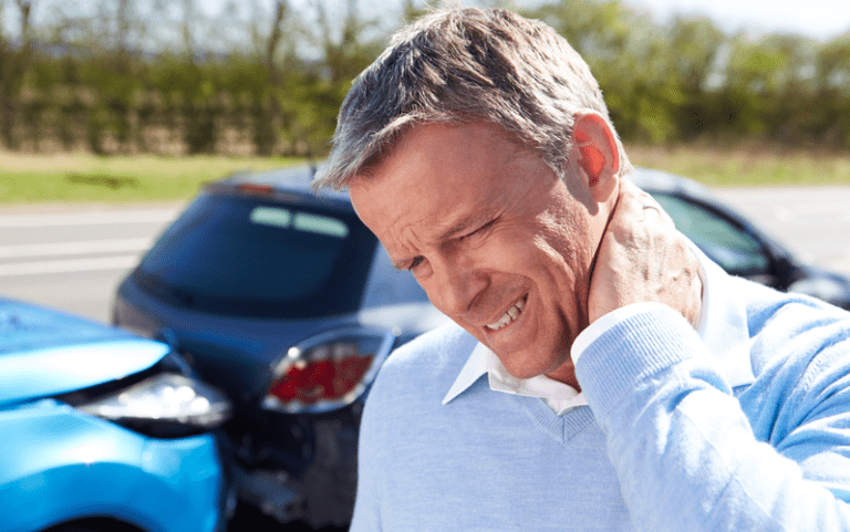 Driver Suffering From Whiplash After Traffic Collision