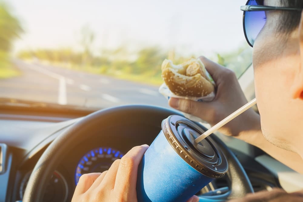 distracted driver with food and drink