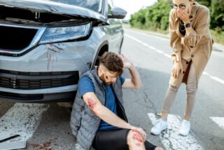 woman-driver-with-injured-man-on-the-road-e-orum-young-law-monroe-la-71201